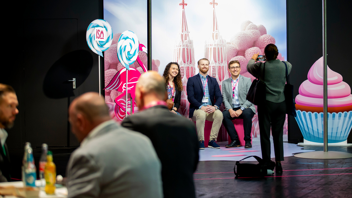 People are taking pictures at the ISM photopoint